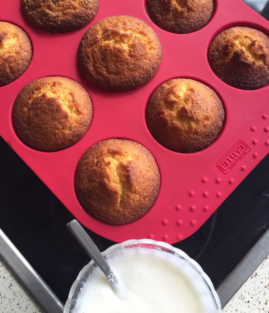 The picture shows a tray of lemon muffins